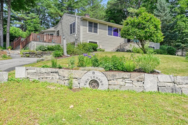 3 The Ledges St, Hallowell, ME 04347 - view of side of property with a deck, a lawn, stairs, and a chimney