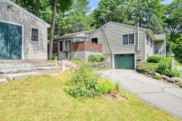 3 The Ledges St, Hallowell, ME 04347 - view of front facade with a garage, asphalt driveway, and a wooden deck