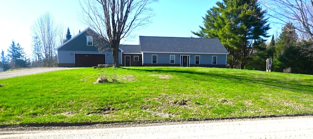 18 Castle Rd, Harmony, ME 04942 - view of front of home featuring driveway, a front lawn, and a garage