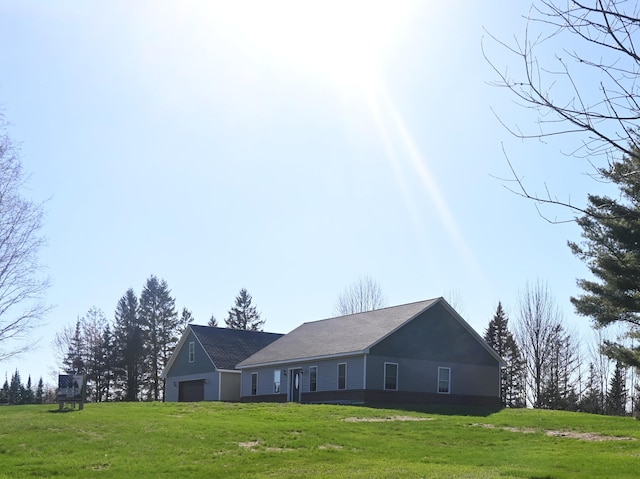 18 Castle Rd, Harmony, ME 04942 - view of front of home featuring an attached garage and a front lawn