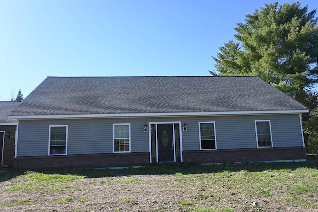 18 Castle Rd, Harmony, ME 04942 - ranch-style house with a shingled roof, a front yard, and brick siding