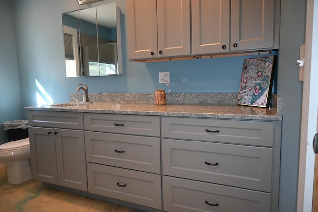 18 Castle Rd, Harmony, ME 04942 - interior space featuring gray cabinets, light stone counters, and a sink