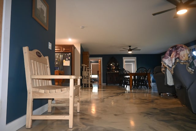 18 Castle Rd, Harmony, ME 04942 - living area with a ceiling fan and concrete flooring