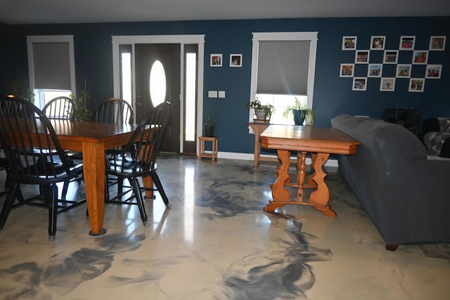 18 Castle Rd, Harmony, ME 04942 - dining room featuring finished concrete flooring, baseboards, and plenty of natural light