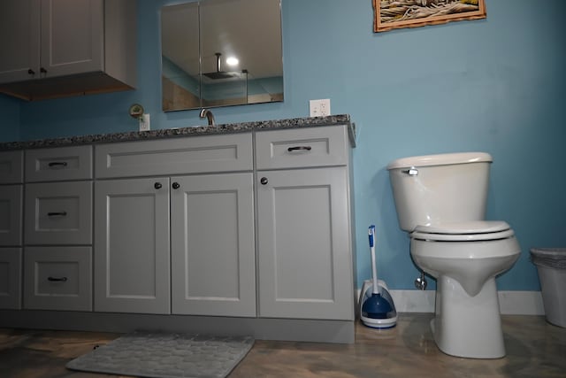 18 Castle Rd, Harmony, ME 04942 - bathroom featuring toilet, concrete flooring, and vanity