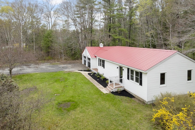 view of subject property with a heavily wooded area