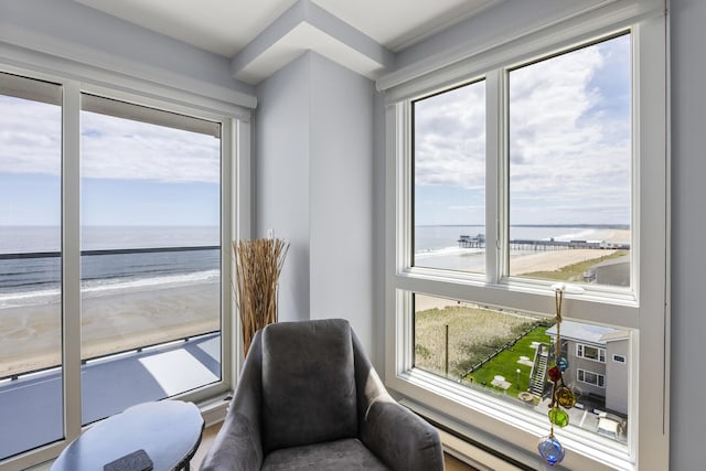 sitting room featuring a water view