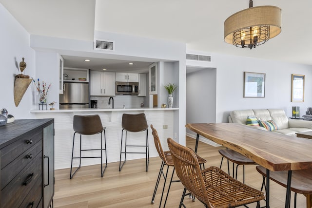 dining room with light wood-style floors
