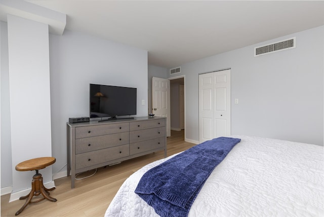 bedroom featuring light wood-type flooring and baseboards