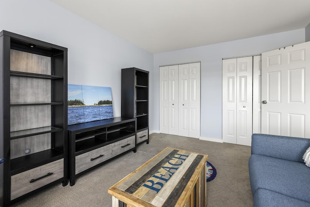 living room with carpet flooring and baseboards