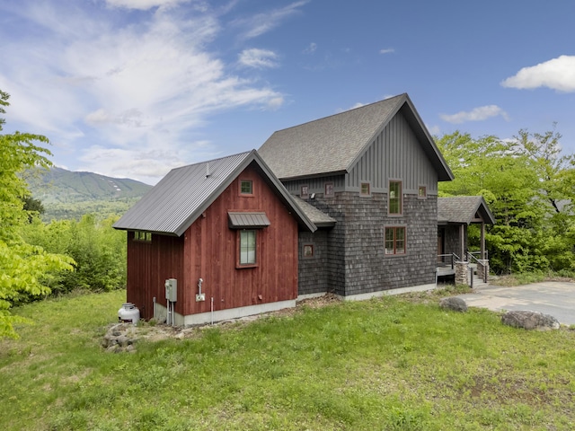 28 Fisher Rd, Newry, ME 04261 - view of home's exterior with a lawn, a shingled roof, and a mountain view