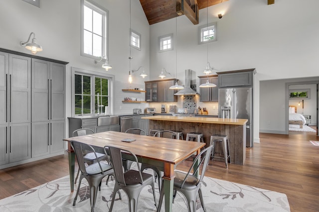 28 Fisher Rd, Newry, ME 04261 - dining room with high vaulted ceiling, hardwood / wood-style floors, and wooden ceiling with exposed beams