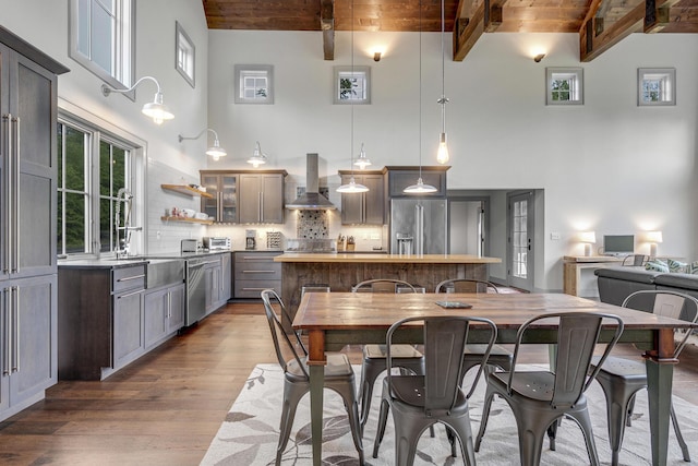28 Fisher Rd, Newry, ME 04261 - dining space featuring a towering ceiling, hardwood / wood-style flooring, and wood ceiling with exposed beams