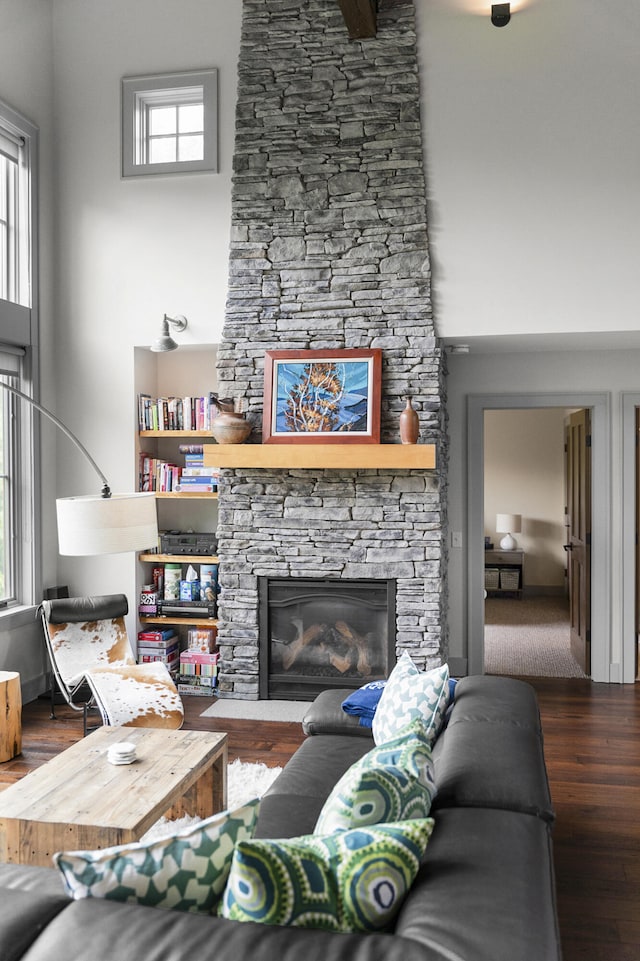 28 Fisher Rd, Newry, ME 04261 - living room with wood finished floors, a fireplace, and healthy amount of natural light