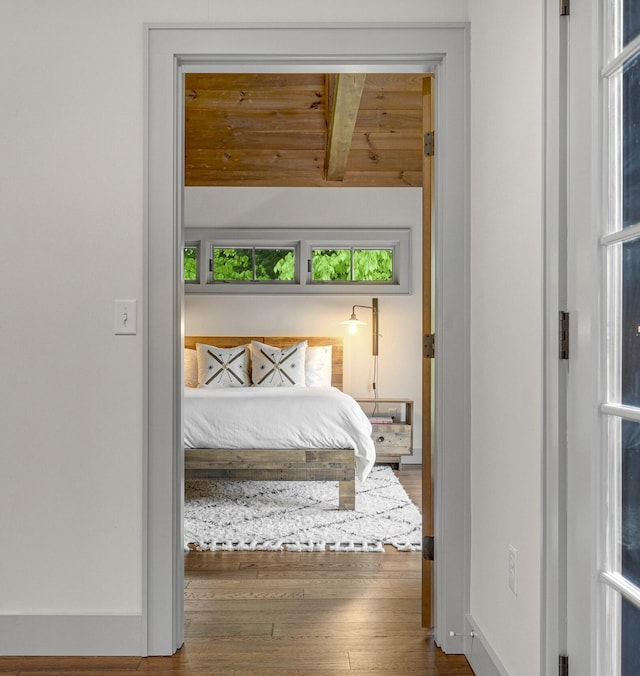 28 Fisher Rd, Newry, ME 04261 - bedroom with wood finished floors and beamed ceiling
