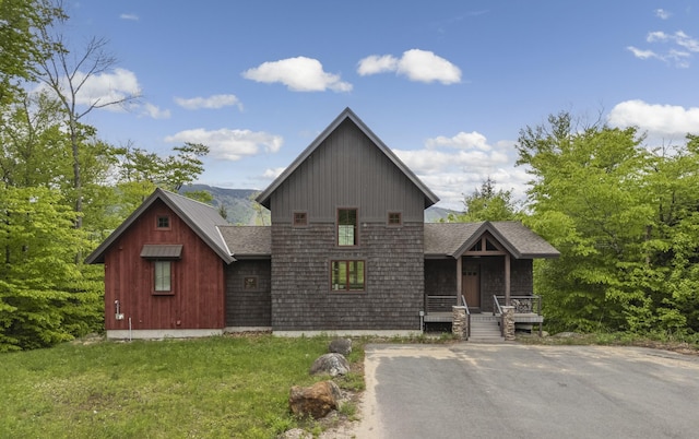 28 Fisher Rd, Newry, ME 04261 - view of front facade with a porch and roof with shingles