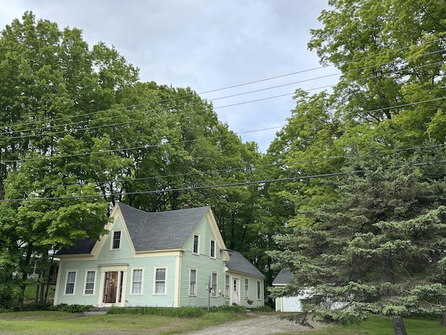111 Town Farm Rd, Farmington, ME 04938 - view of front of home with a shingled roof, a chimney, and a garage