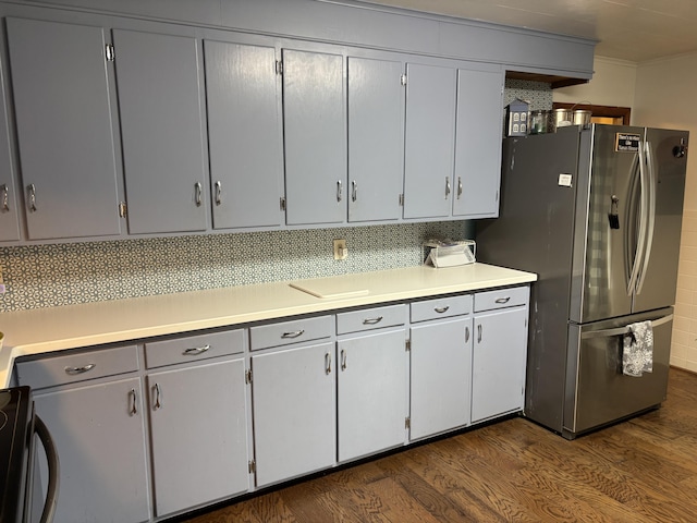 111 Town Farm Rd, Farmington, ME 04938 - kitchen with freestanding refrigerator, dark wood finished floors, light countertops, and ornamental molding