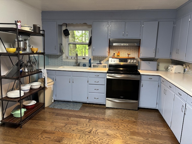 111 Town Farm Rd, Farmington, ME 04938 - kitchen featuring stainless steel range with electric stovetop, a sink, under cabinet range hood, dark wood finished floors, and light countertops
