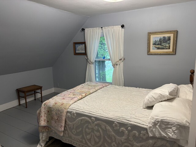 111 Town Farm Rd, Farmington, ME 04938 - bedroom with vaulted ceiling and baseboards