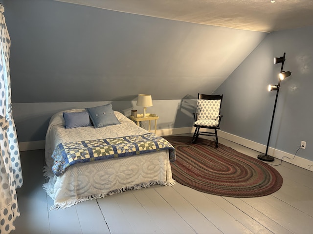 111 Town Farm Rd, Farmington, ME 04938 - bedroom featuring vaulted ceiling and baseboards