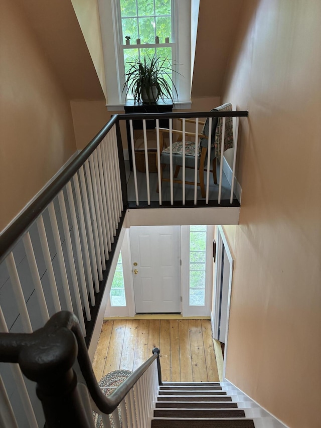 111 Town Farm Rd, Farmington, ME 04938 - stairs featuring wood-type flooring and healthy amount of natural light