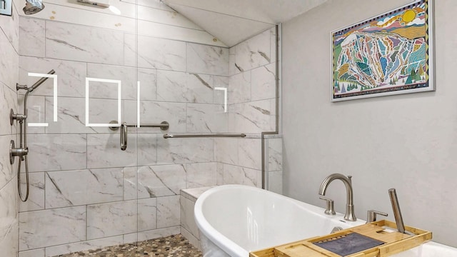 full bath with a freestanding tub, lofted ceiling, and a shower stall