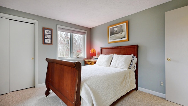 carpeted bedroom with baseboards