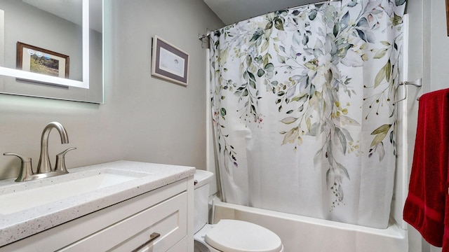 bathroom featuring toilet, shower / bathtub combination with curtain, and vanity