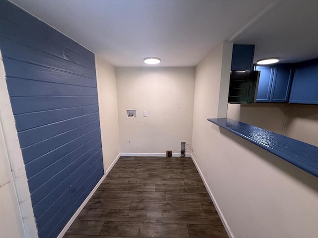 laundry area with washer hookup, baseboards, laundry area, and dark wood-type flooring