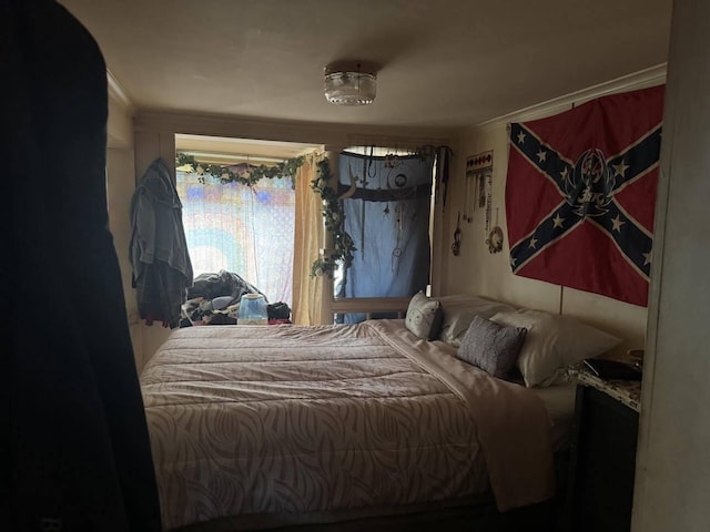 bedroom featuring ornamental molding