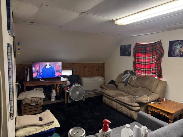carpeted living room with vaulted ceiling