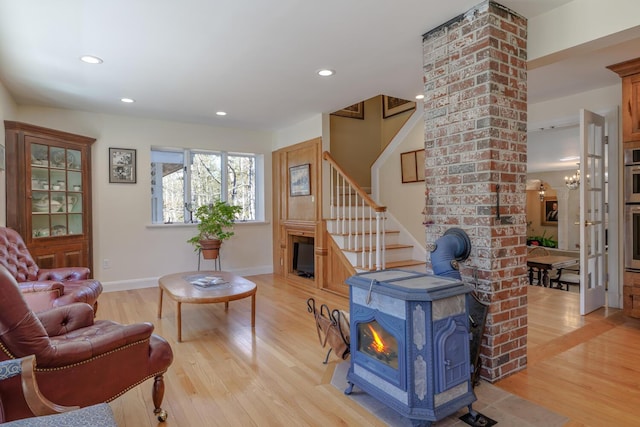 20 Giant Slide Rd, Mount Desert, ME 04660 - living room with a wood stove, light wood-style floors, stairs, recessed lighting, and baseboards