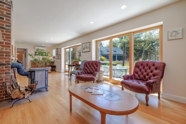 20 Giant Slide Rd, Mount Desert, ME 04660 - living room with plenty of natural light, light wood finished floors, baseboards, recessed lighting, and a wood stove