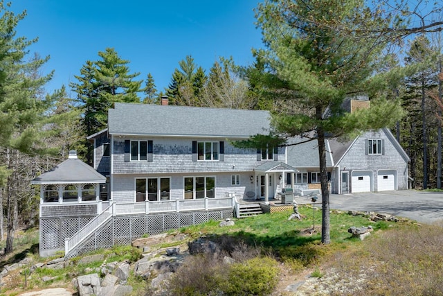 20 Giant Slide Rd, Mount Desert, ME 04660 - view of front facade featuring a gazebo, a chimney, a wooden deck, driveway, and roof with shingles