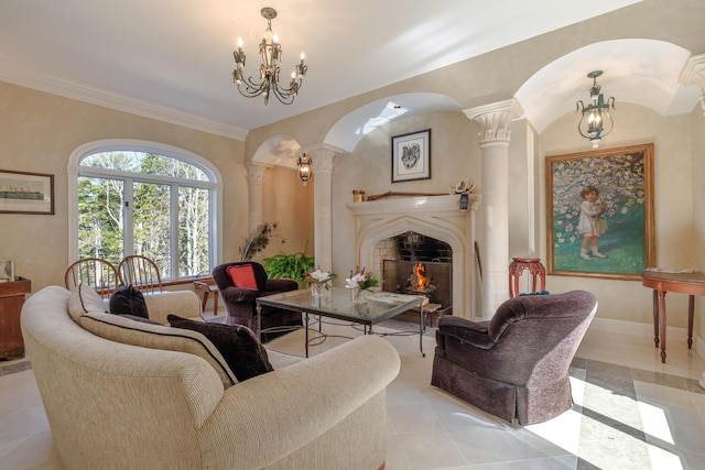 20 Giant Slide Rd, Mount Desert, ME 04660 - living area with decorative columns, a lit fireplace, a chandelier, arched walkways, and light tile patterned floors