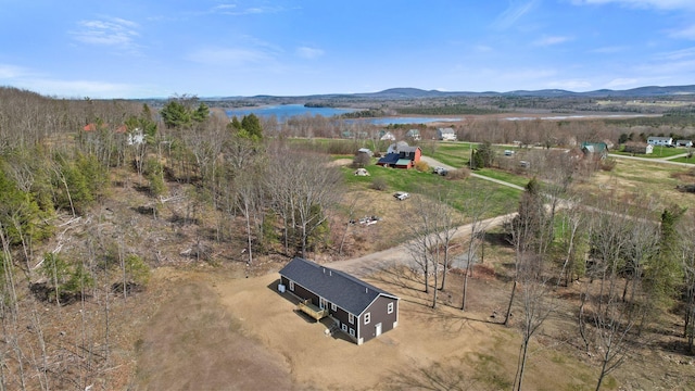 aerial view featuring a rural view and a water and mountain view