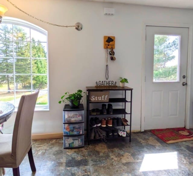 interior space featuring stone finish floor