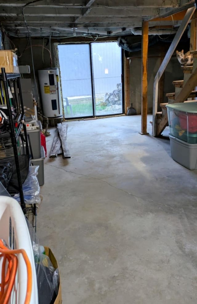 below grade area featuring water heater and stairs