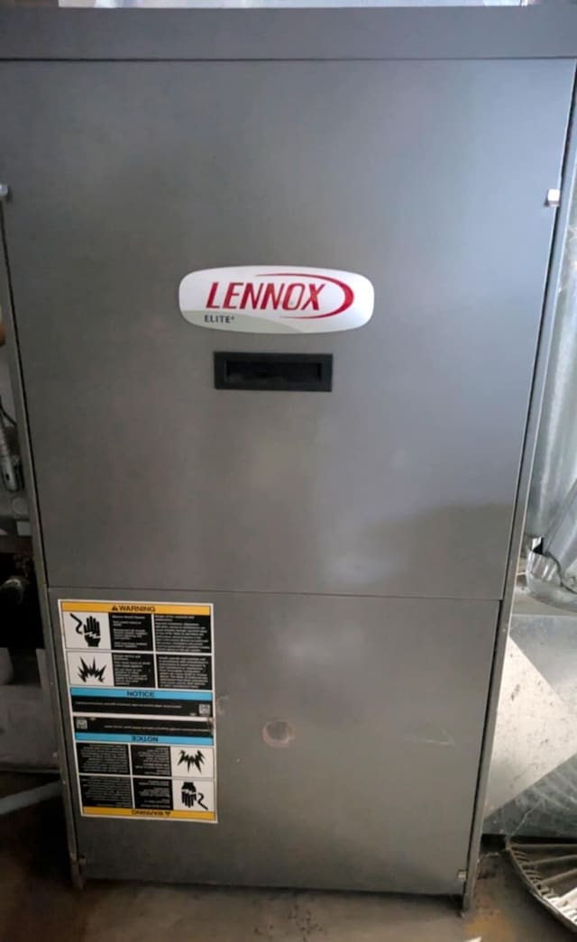 details featuring heating unit and concrete floors