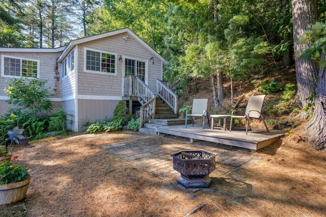 92 Red Gate Ln, Acton, ME 04001 - rear view of house featuring a fire pit
