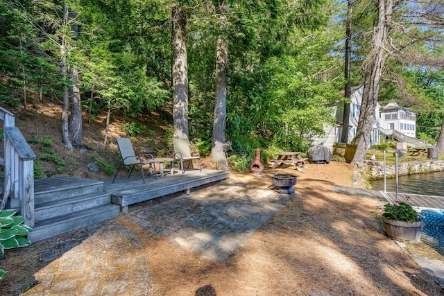 92 Red Gate Ln, Acton, ME 04001 - view of yard with a wooden deck and a fire pit