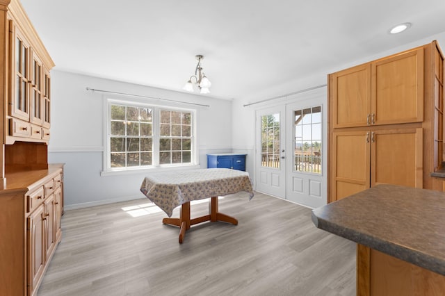 rec room with light wood-style floors, recessed lighting, baseboards, and a chandelier
