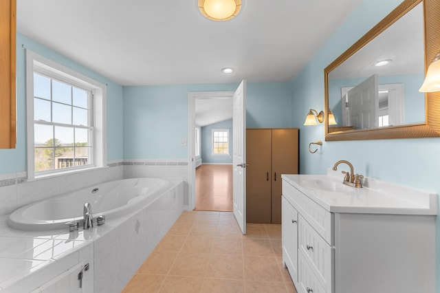 full bathroom featuring recessed lighting, tile patterned floors, a bath, and vanity