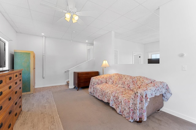 sitting room featuring baseboards, ceiling fan, and wood finished floors
