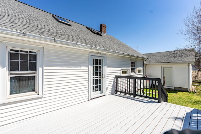 wooden terrace with a yard