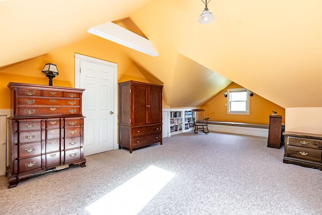 additional living space with vaulted ceiling and carpet flooring