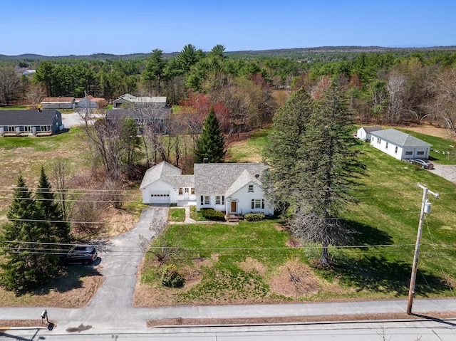 drone / aerial view featuring a view of trees