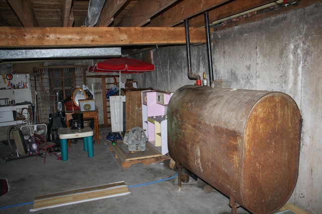 unfinished basement featuring heating fuel