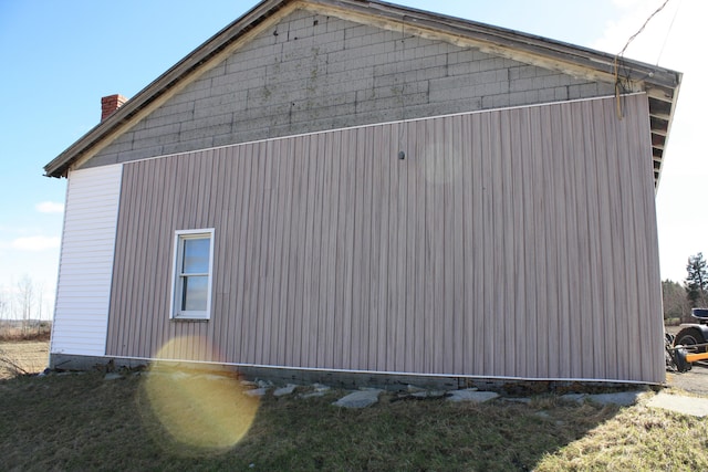 view of property exterior with a chimney